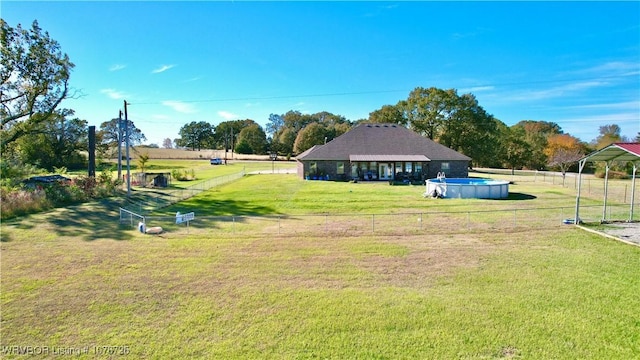 view of yard with a fenced in pool