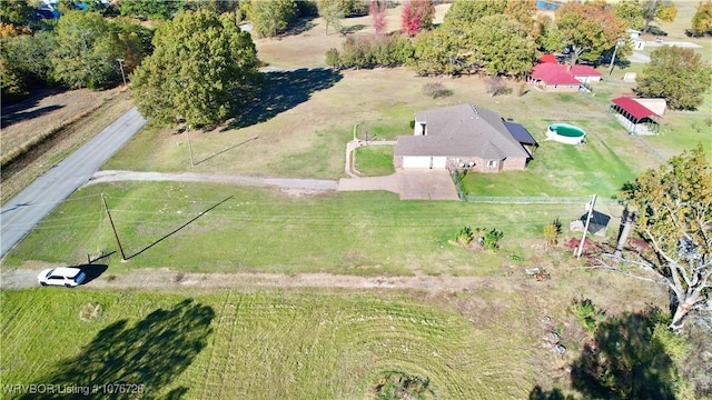 birds eye view of property with a rural view