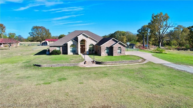 ranch-style house with a front lawn