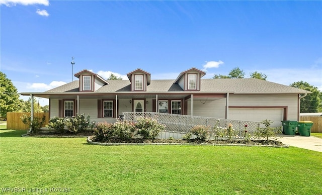 cape cod house with a porch, a garage, and a front lawn