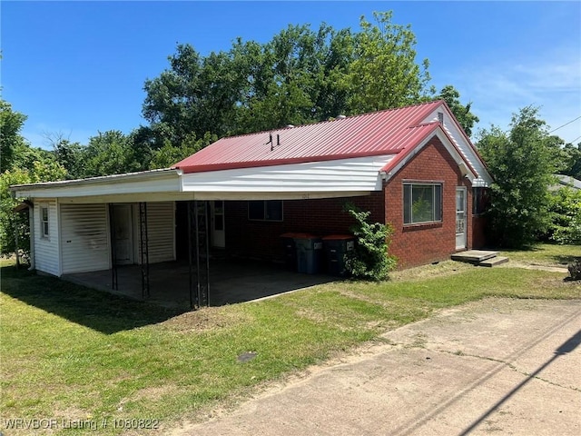 garage with driveway and an attached carport