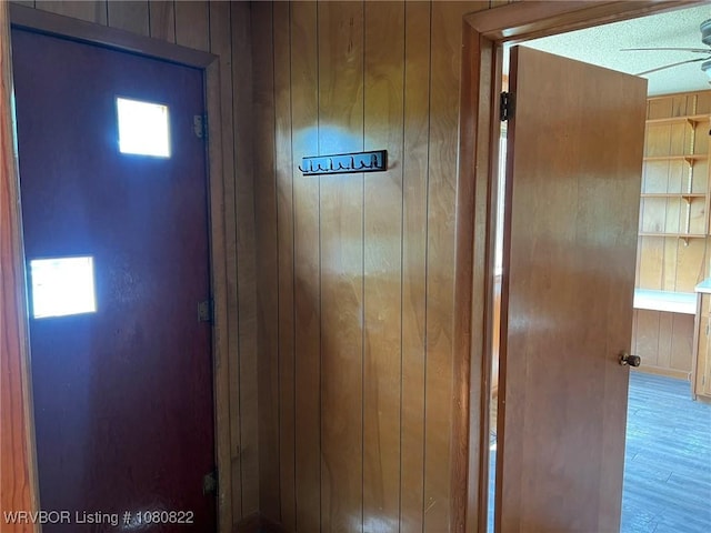 interior details with wooden walls and wood finished floors