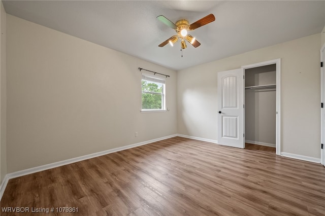 96708 S 4515, Vian, OK 74962 - unfurnished bedroom featuring wood finished floors, baseboards, a closet, and ceiling fan