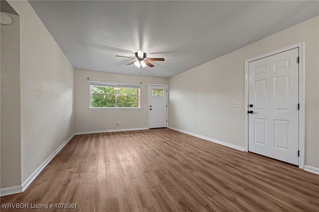 96708 S 4515, Vian, OK 74962 - spare room with a ceiling fan, wood finished floors, and baseboards