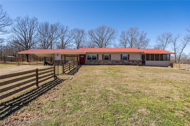 ranch-style house with metal roof, an outdoor structure, and an exterior structure