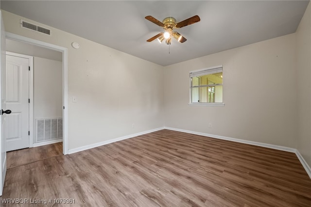 96708 S 4515, Vian, OK 74962 - unfurnished room featuring ceiling fan, wood finished floors, and baseboards
