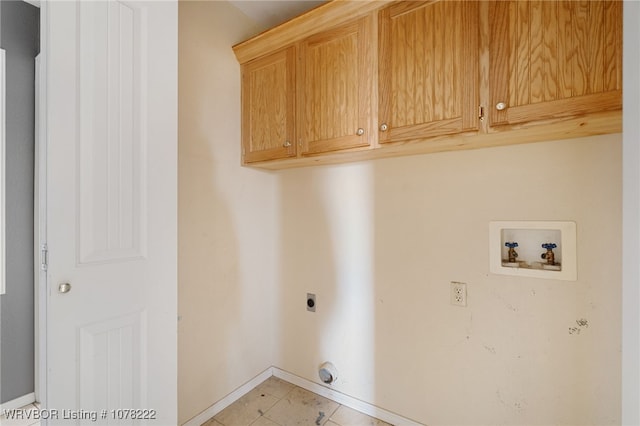 laundry room featuring cabinets, hookup for a washing machine, light tile patterned floors, and electric dryer hookup