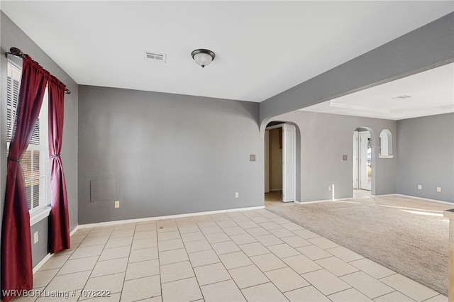 unfurnished room with light colored carpet