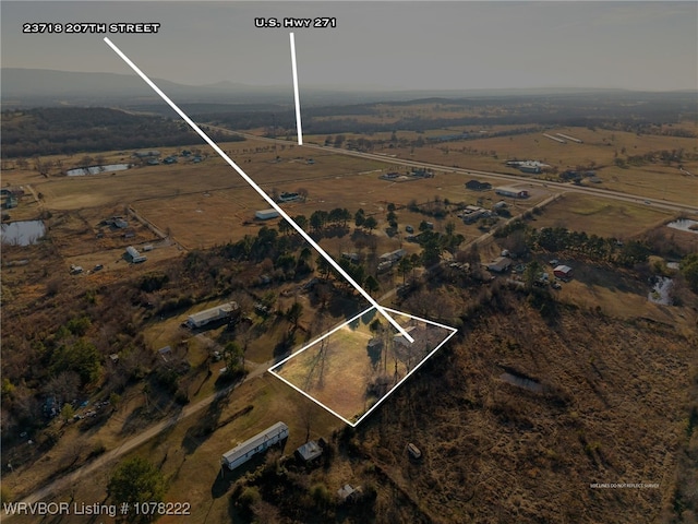 birds eye view of property featuring a rural view