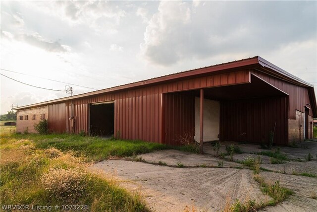 view of side of property featuring an outbuilding