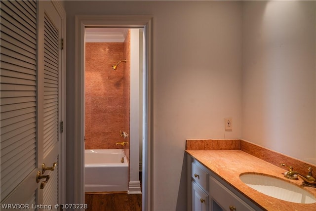 bathroom with hardwood / wood-style floors and vanity