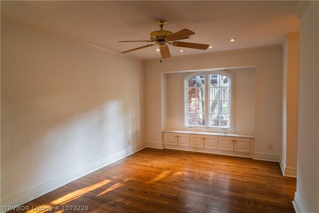 unfurnished room featuring ceiling fan, wood-type flooring, and ornamental molding