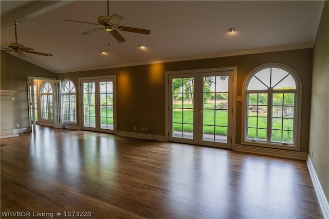 unfurnished living room featuring french doors, plenty of natural light, and lofted ceiling