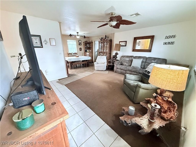 205 Lee Ordner, Panama, OK 74951 - living area featuring visible vents, ceiling fan, and tile patterned flooring