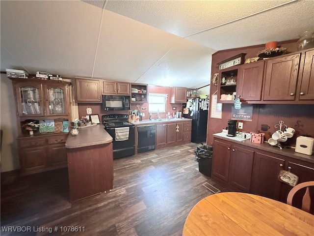 205 Lee Ordner, Panama, OK 74951 - kitchen featuring open shelves, vaulted ceiling, dark wood-style floors, black appliances, and a sink