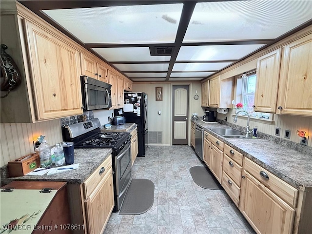 205 Lee Ordner, Panama, OK 74951 - kitchen with a sink, visible vents, appliances with stainless steel finishes, and light brown cabinetry