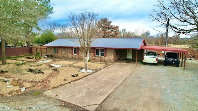 205 Lee Ordner, Panama, OK 74951 - single story home featuring an attached carport, fence, metal roof, stone siding, and driveway