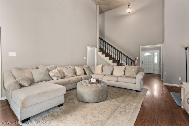 living room with dark hardwood / wood-style flooring