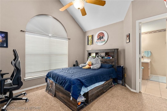 carpeted bedroom with vaulted ceiling and ceiling fan