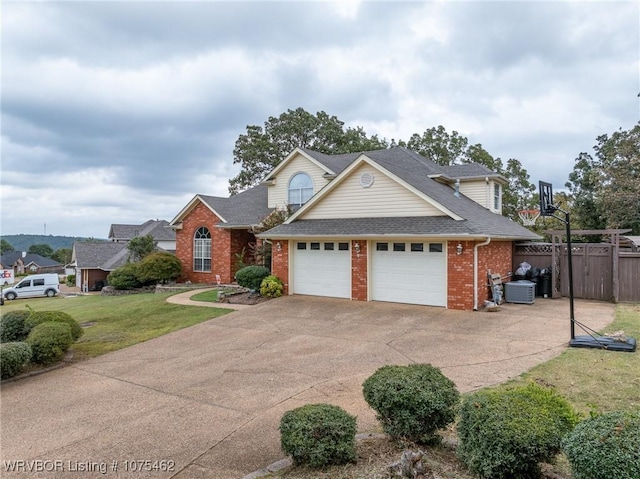 view of front property with a garage and a front lawn