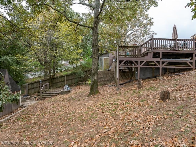 view of yard featuring a wooden deck