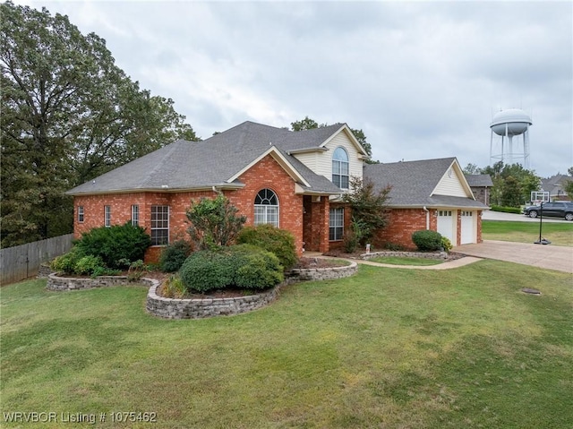 view of front of property featuring a front yard and a garage