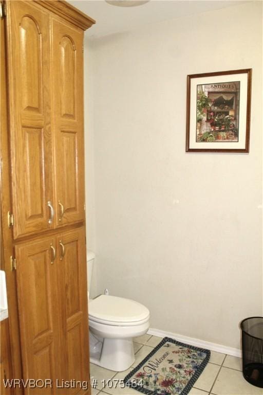 bathroom with tile patterned floors and toilet