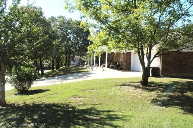 view of yard with a garage