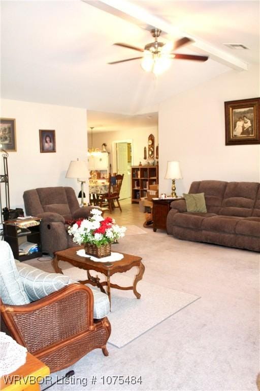 living room with vaulted ceiling with beams and ceiling fan