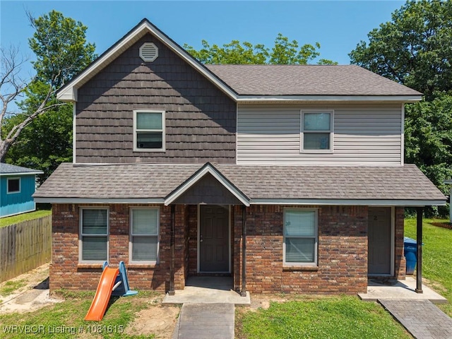 603 Birch St, Muldrow, OK 74948 - view of front of property featuring a shingled roof and brick siding