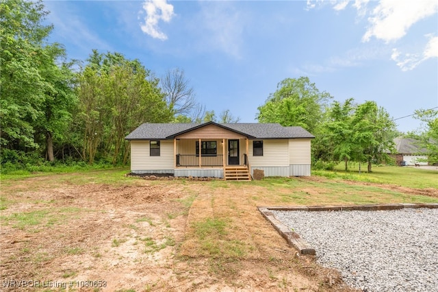 back of house with a yard and a porch