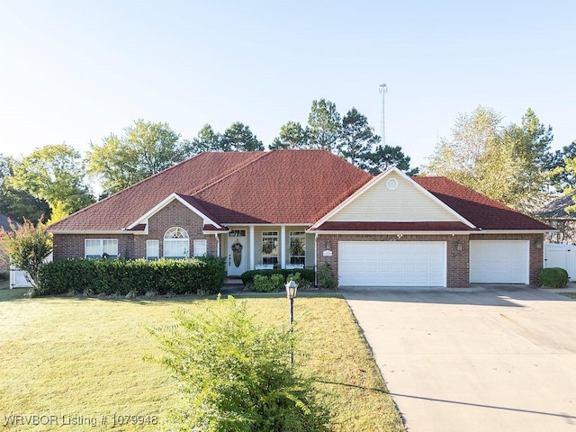 6408 Southfield Dr, Fort Smith, AR 72916 - single story home with brick siding, a garage, concrete driveway, and a front yard