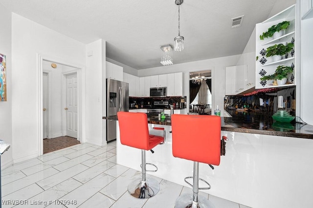 6408 Southfield Dr, Fort Smith, AR 72916 - kitchen with white cabinets, visible vents, marble finish floor, stainless steel appliances, and open shelves