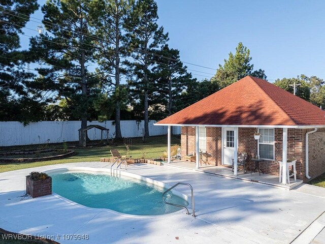 6408 Southfield Dr, Fort Smith, AR 72916 - view of pool with an outdoor structure, fence, a fenced in pool, a patio area, and a lawn