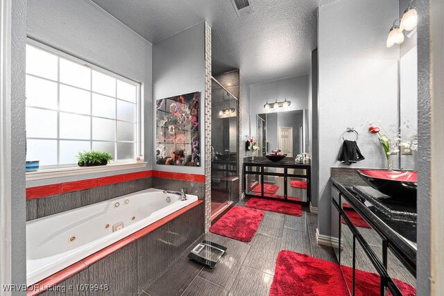 6408 Southfield Dr, Fort Smith, AR 72916 - full bath featuring a shower stall, a whirlpool tub, visible vents, and a textured ceiling