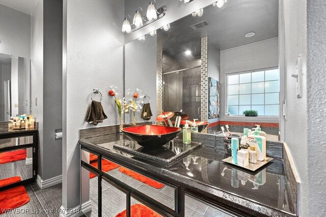 6408 Southfield Dr, Fort Smith, AR 72916 - bathroom featuring vanity, a shower stall, baseboards, and visible vents
