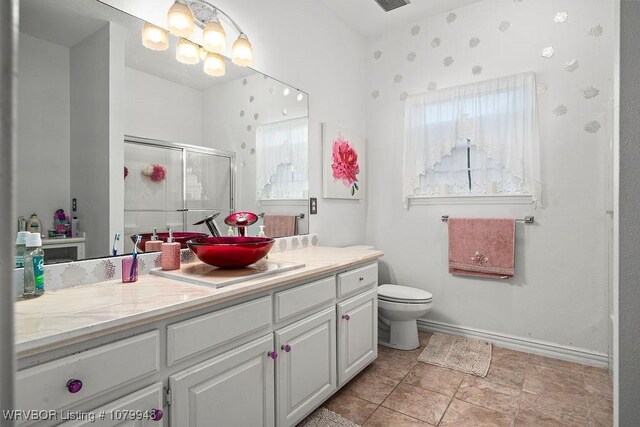 6408 Southfield Dr, Fort Smith, AR 72916 - full bathroom with a stall shower, toilet, vanity, baseboards, and visible vents