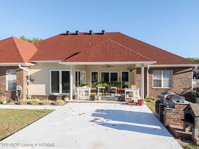 6408 Southfield Dr, Fort Smith, AR 72916 - back of house with a patio, a ceiling fan, brick siding, roof with shingles, and an outdoor kitchen