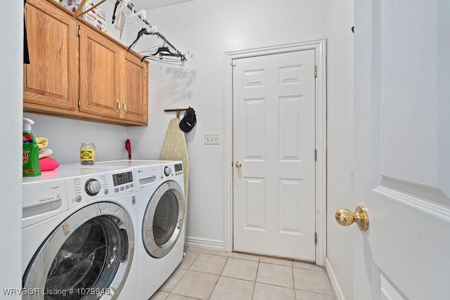 6408 Southfield Dr, Fort Smith, AR 72916 - laundry room with light tile patterned floors, cabinet space, baseboards, and washer and dryer
