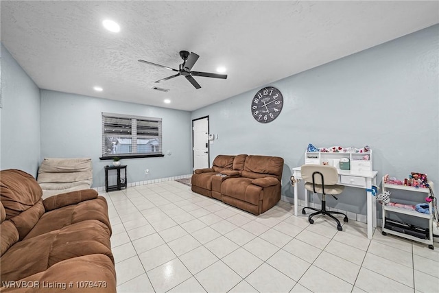 living area featuring visible vents, baseboards, ceiling fan, recessed lighting, and a textured ceiling