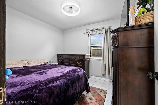 bedroom featuring light tile patterned floors