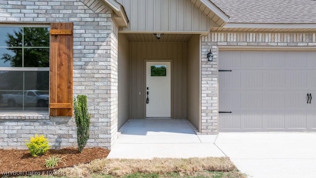 doorway to property featuring a garage