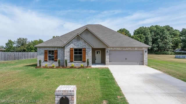 view of front facade with a garage and a front lawn