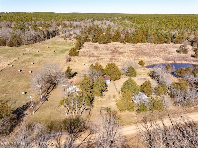 birds eye view of property featuring a water view and a rural view