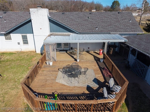 back of property with a deck