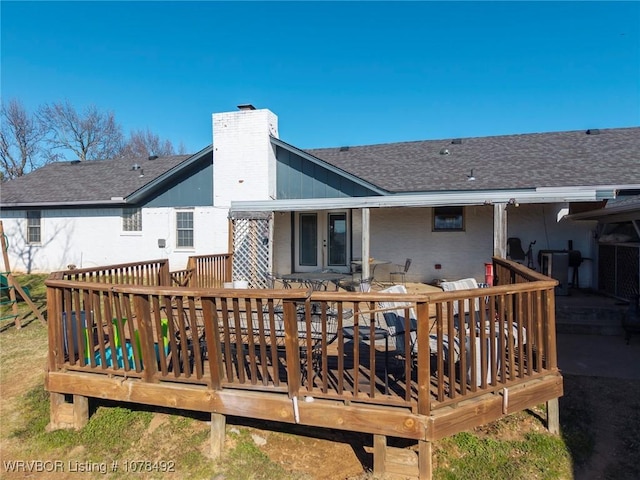 rear view of house with a deck