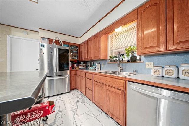 kitchen with decorative backsplash, sink, appliances with stainless steel finishes, and crown molding