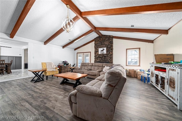 living room with a textured ceiling, dark hardwood / wood-style floors, and vaulted ceiling with beams