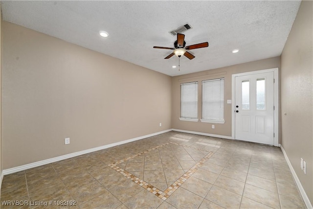 105 N Circle B, Roland, OK 74954 - tiled empty room with a ceiling fan, recessed lighting, and a textured ceiling