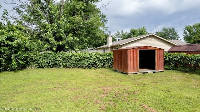 105 N Circle B, Roland, OK 74954 - view of grassy yard featuring a storage unit